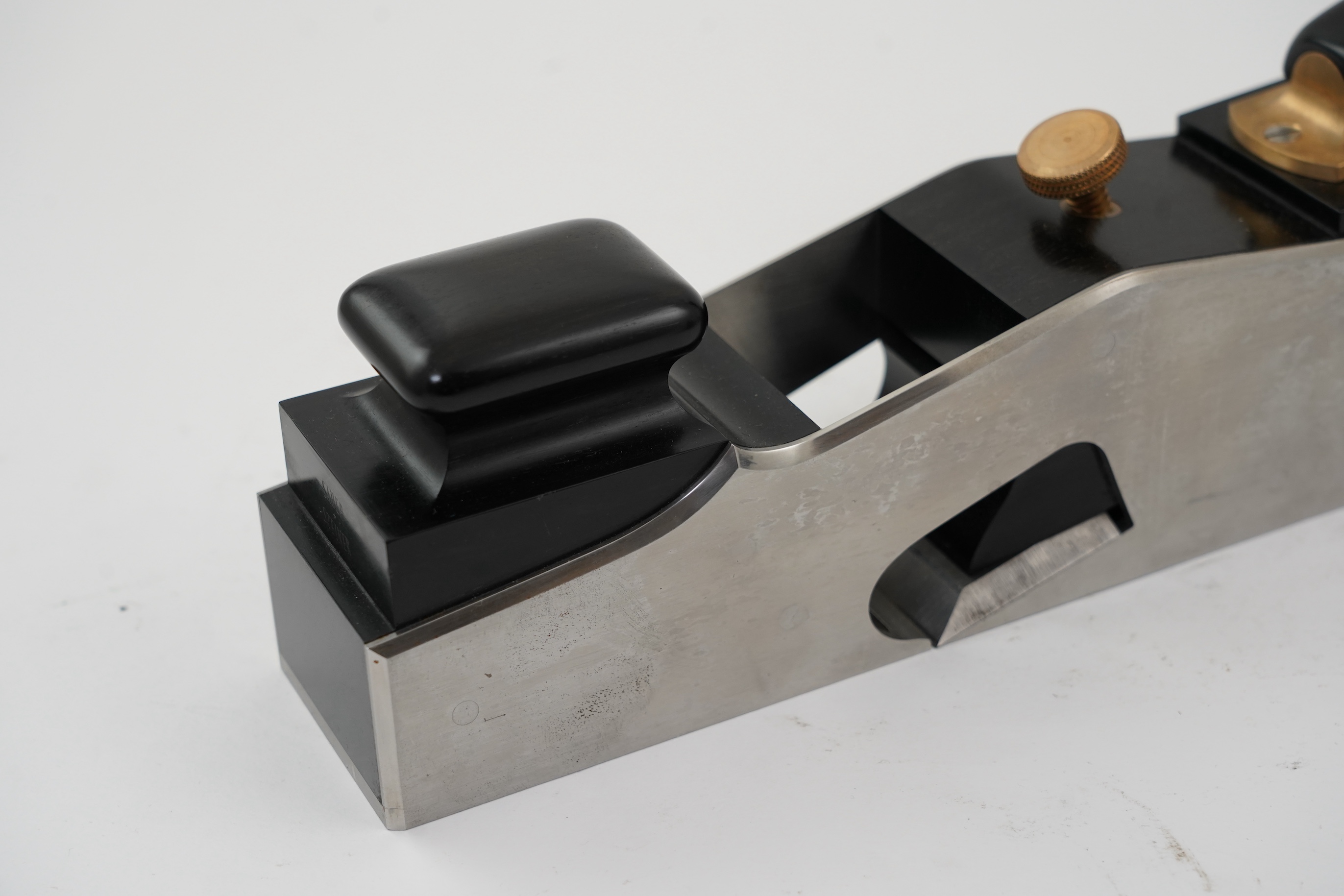 A very fine modern rebate mitre plane by Sauer & Steiner Toolworks, Ontario, handmade in the style of a Norris rebate mitre plane, with ebony infill, handle and wedge, adjustable iron, the handle on an adjustable lateral